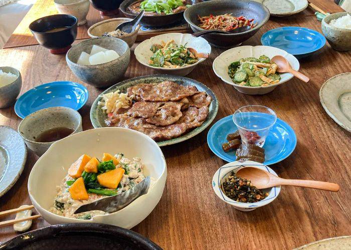 A table filled with a range of home-cooked Japanese dishes.